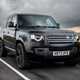 Land Rover Defender 130 V8 review: front three quarter driving, British B-road, low angle, black paint