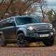 Land Rover Defender 130 V8 review: front three quarter off-roading, cornering, black paint