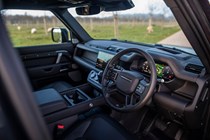Land Rover Defender 130 V8 review: front seats and dashboard, black upholstery
