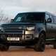 Land Rover Defender 130 V8 review: front three quarter static, black paint