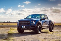 Ford F-150 Raptor review - blue, front view, parked off-road in the UK, muddy