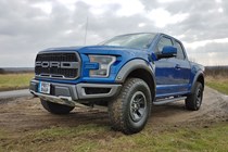 Ford F-150 Raptor review - blue, front view, low, parked off road
