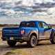 Ford F-150 Raptor review - blue, rear view, parked off-road in the UK, muddy