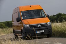 VW Crafter vs Mercedes Sprinter - Crafter, orange, front view, driving