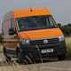 VW Crafter vs Mercedes Sprinter - Crafter, orange, front view, driving