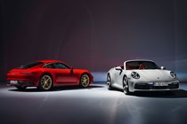 Red 2021 Porsche 911 Carrera Coupe and white 2021 Porsche 911 Carrera Cabriolet