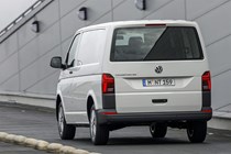 VW Transporter T6.1 facelift - rear view, white panel van, driving