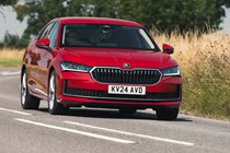 The safest cars on sale: Skoda Superb, front three quarter driving, red paint