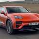 The safest cars on sale: Porsche Macan, front three quarter driving, orange paint