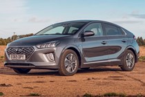 A silver grey IONIQ Hybrid parked on a red sand location
