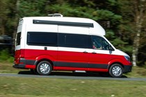 VW Grand California camper review - 2019 UK 600 model, side view, driving, red and white