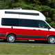 VW Grand California camper review - 2019 UK 600 model, side view, driving, red and white