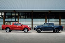 2019 Nissan Navara - red King Cab, blue Double Cab, side view parked nose-to-nose