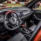 Skoda Mountiaq pickup truck review - cab interior, dashboard, steering wheel, finished in black and orange