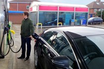 Man refuelling Mercedes CLS - What is miles per pound