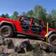 Jeep Gladiator review - red, side view, tube doors, off-road