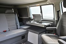 VW California T6.1 campervan - 2019, 2020, Beach, wider view of lounge area with kitchen deployed