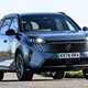 Peugeot e-5008 Deal Watch, front three quarters, driving, blue Deal Watch | Parkers