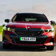 BMW i5 Touring Deal Watch, front shot, driving, red, Deal Watch | Parkers