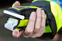 Breath test held by a police officer