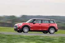 Red 2019 MINI Clubman side elevation driving