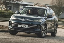 Best family SUVs based on testing and reviews by Parkers, fully updated for 2024 - VW Tiguan driving round corner