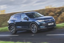 Best family SUVs - 2024 VW Tiguan, side view, driving