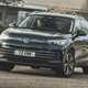 Best family SUVs based on testing and reviews by Parkers, fully updated for 2024 - VW Tiguan driving round corner