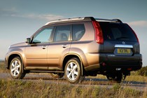Best used family 4x4s: Nissan X-Trail, rear three quarter static, brown paint, British B-road