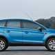 Best used family 4x4s: Ford Kuga, side view static, blue paint