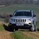 Best used family 4x4s: Jeep Compass, front three quarter static, silver paint, off-road