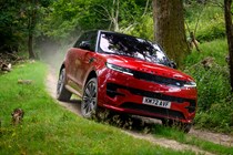 How to drive off-road: Range Rover Sport, driving on a gravel road, cornering shot, low angle, blue paint