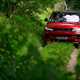 How to drive off-road: Range Rover Sport, driving on grass ruts, low angle, red paint