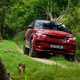 How to drive off-road: Range Rover Sport, driving on a gravel road, low angle, blue paint