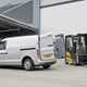 LEVC VN5 electric van based on London taxi - rear view, silver, doors open, with forklift