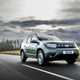 Dacia Duster green front driving - Best SUVs for towing