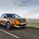 Peugeot 2008 orange front driving - Best SUVs for towing