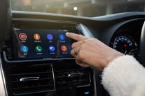 If you need to make a call while driving, it's best to use your car's built-in Bluetooth.