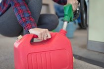 Filling a fuel can from a petrol pump