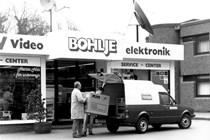 VW Caddy 1 - van being loaded with electronics, black and white