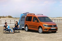 VW Caddy 4 - Beach camper, orange, front view, camping on beach