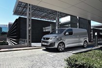 Peugeot e-Expert electric van - silver, front view, charging on driveway, 2020