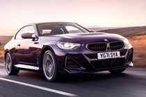 The best coupes to buy in 2024: BMW M240i, front three quarter driving, purple paint