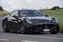 The best coupes to buy in 2024: Maserati GranTurismo, front three quarter cornering, black paint