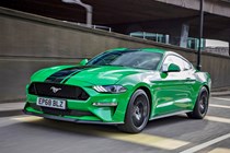 Green and black 2018 Ford Mustang Fastback front three-quarter driving
