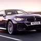 The best coupes to buy in 2024: BMW M240i, front three quarter driving, purple paint