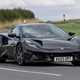 The best coupes to buy in 2024: Lotus Emira, front three quarter cornering, black paint