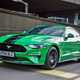Green and black 2018 Ford Mustang Fastback front three-quarter driving