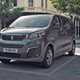 Grey 2020 Peugeot e-Traveller on charge front three-quarter