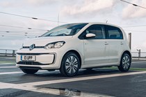 VW electric cars - e-Up, charging, white, front view